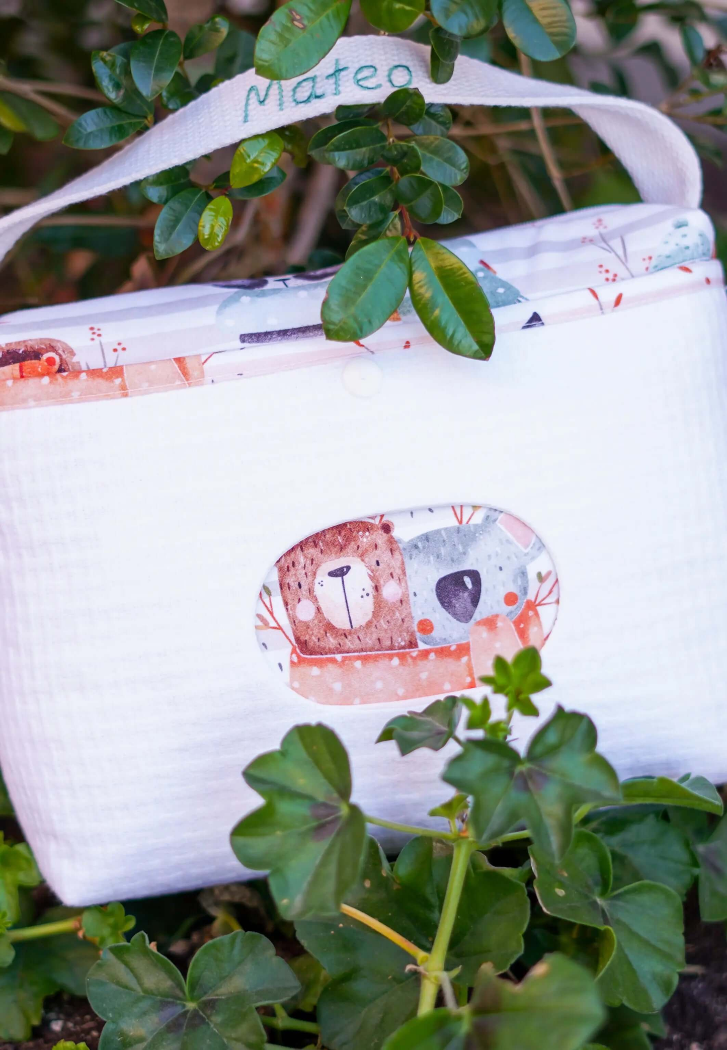 Pañalera impermeable porta pañales y toallitas animalitos