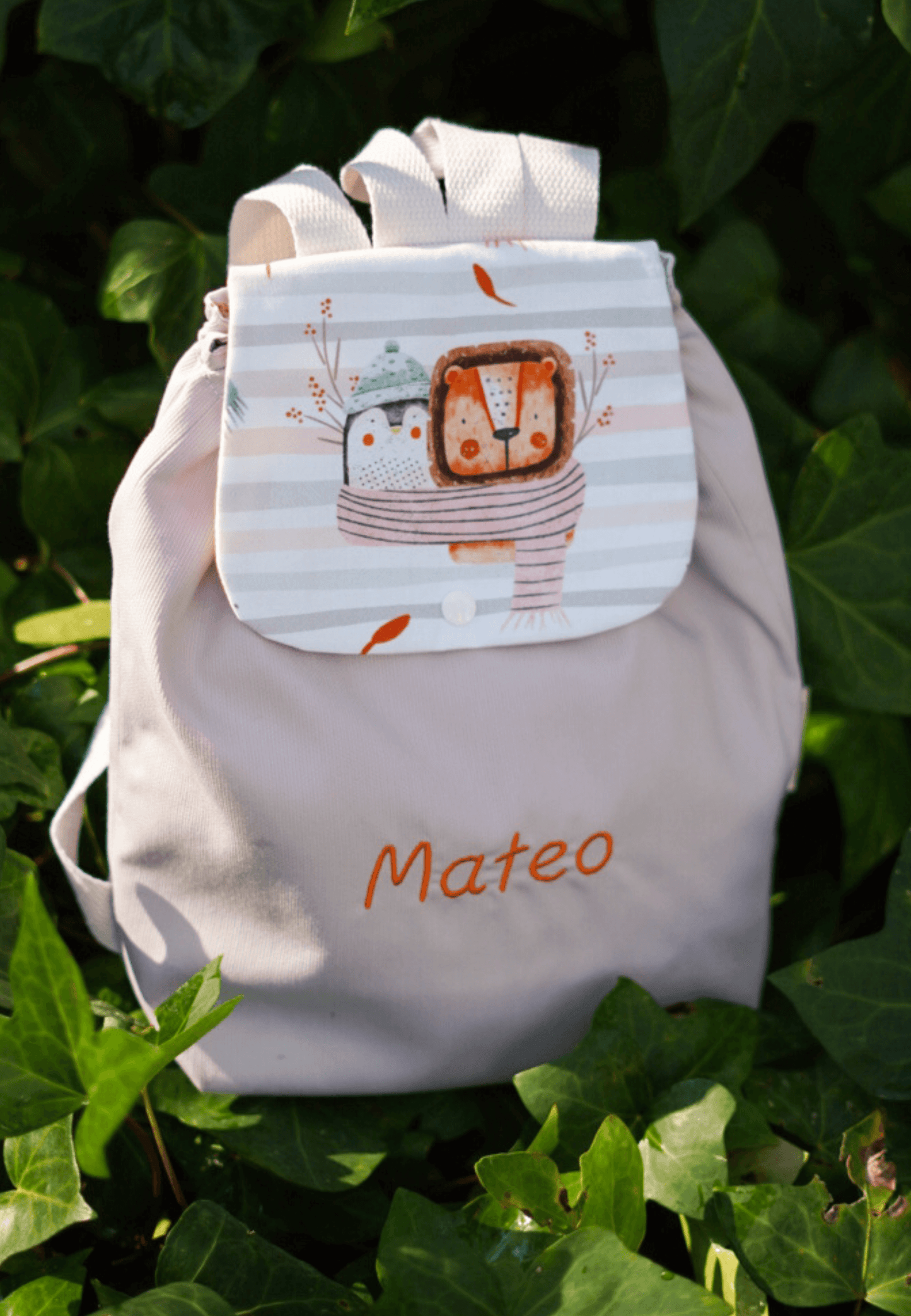 mochila para bebe personalizada con pinguino y león